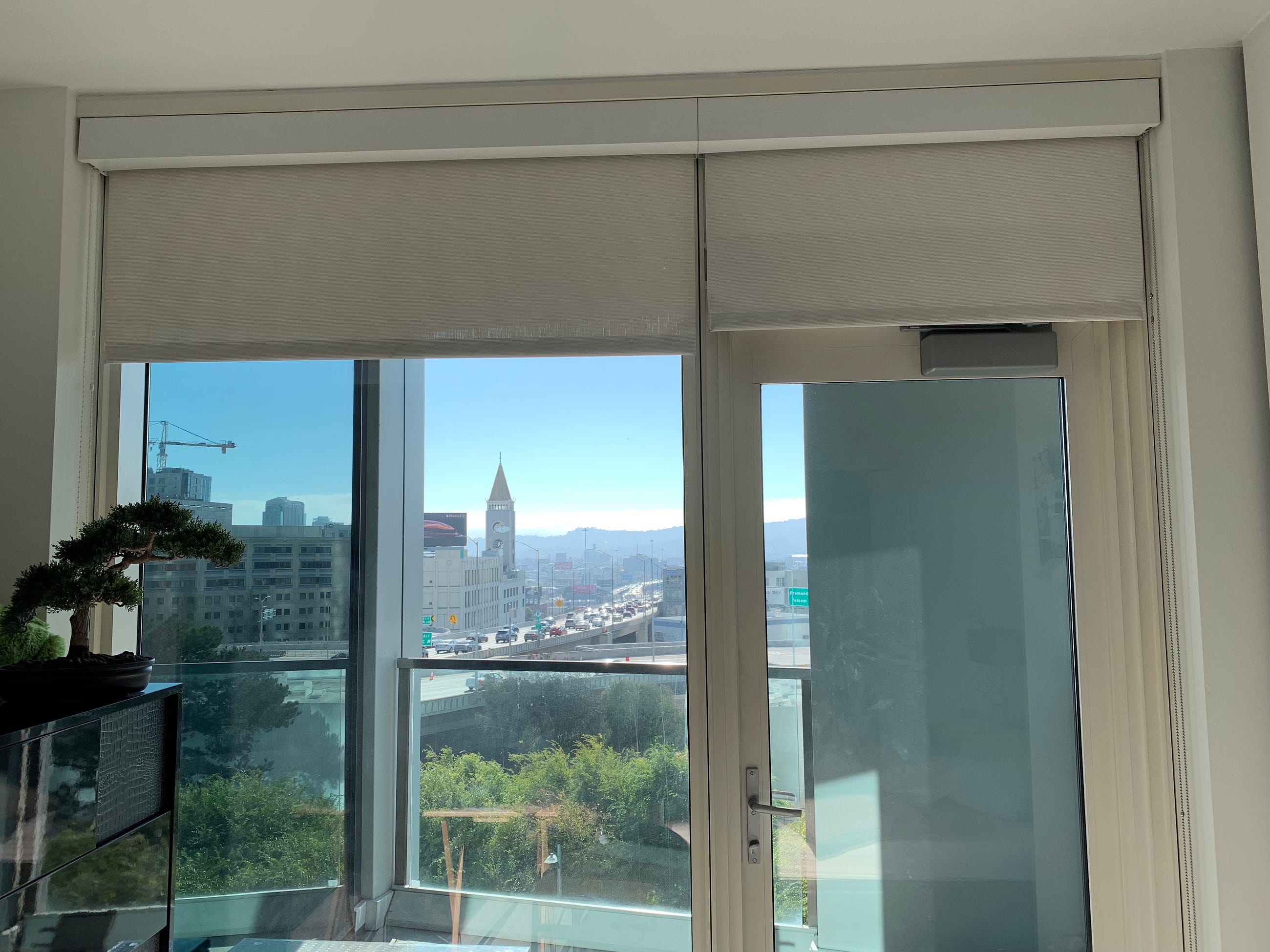 Floor-to-ceiling roller shades in the apartment window